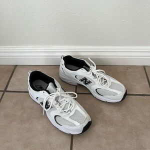 New Balance 530 Sneakers in black, white, and silver